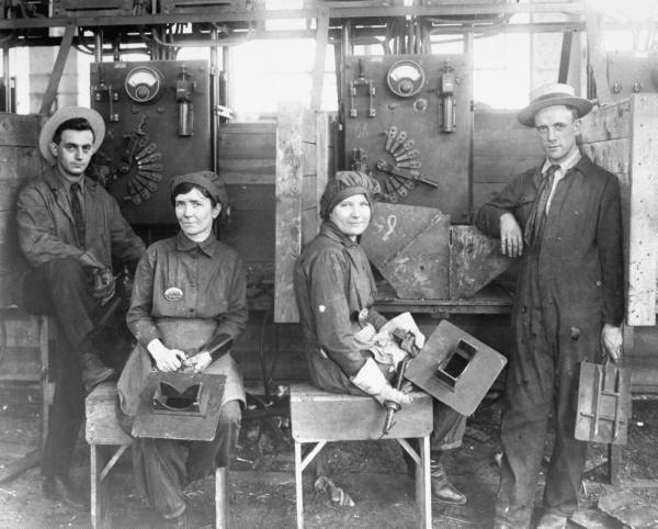 women-electric-welders-sitting-in-work-stations-alongside-male-co-workers-at-hog-island-shipyard-during-wwi-as-the-first-women-to-be-engaged-in-actual-wartime-ship-construction